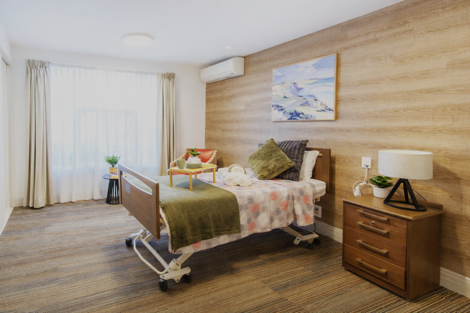 A spacious Superior Room at Burpengary Manor Aged Care with wood-look feature walls, large windows, and private ensuite.